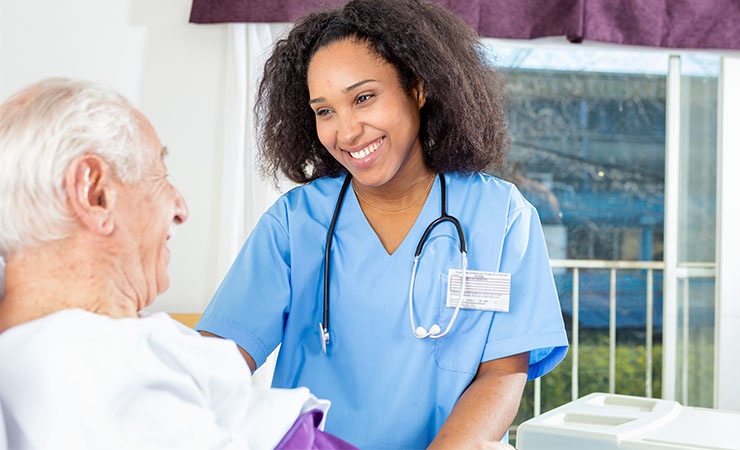 Nurse caring for elderly patient