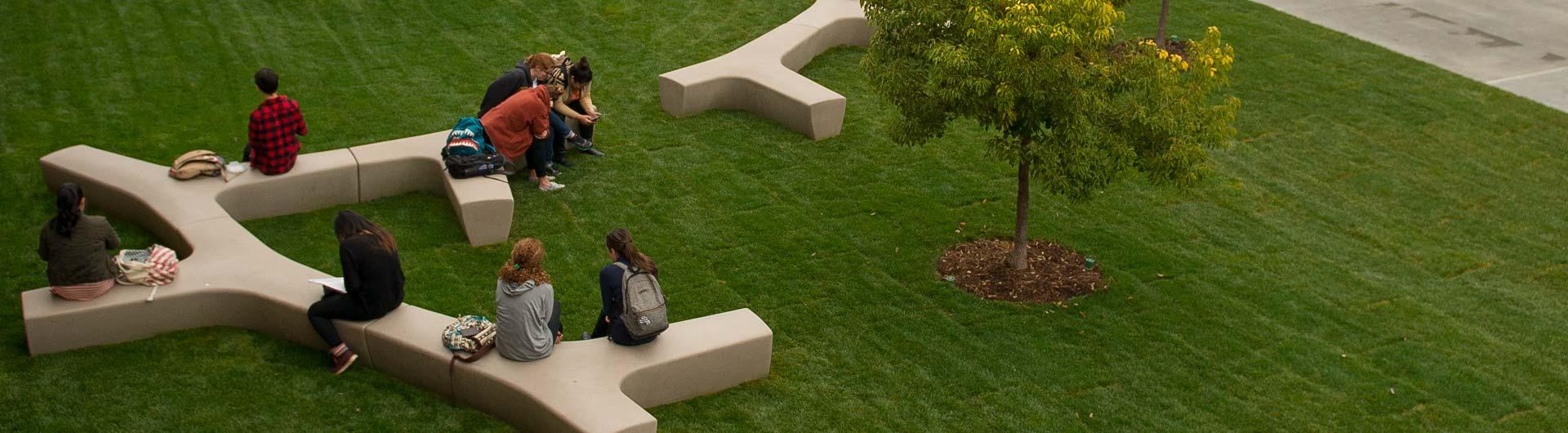 Students on campus benches